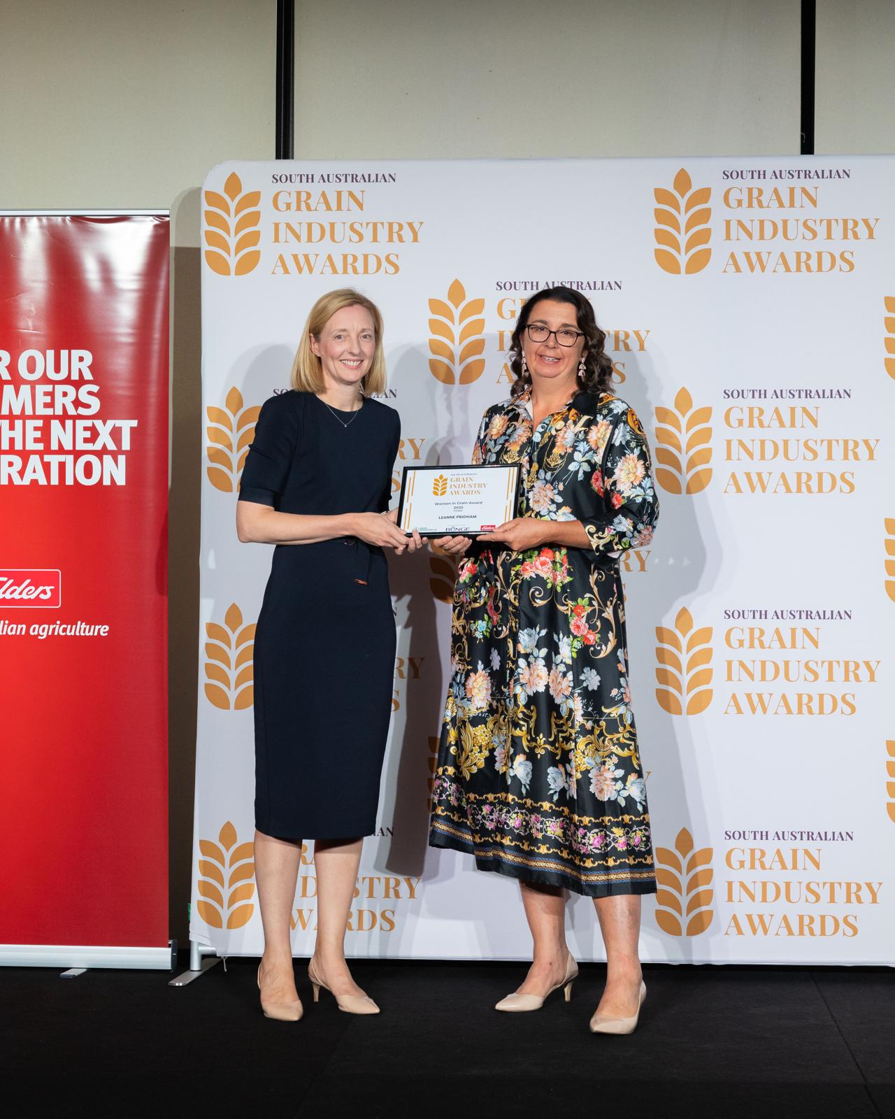 A finalist receives her certificate