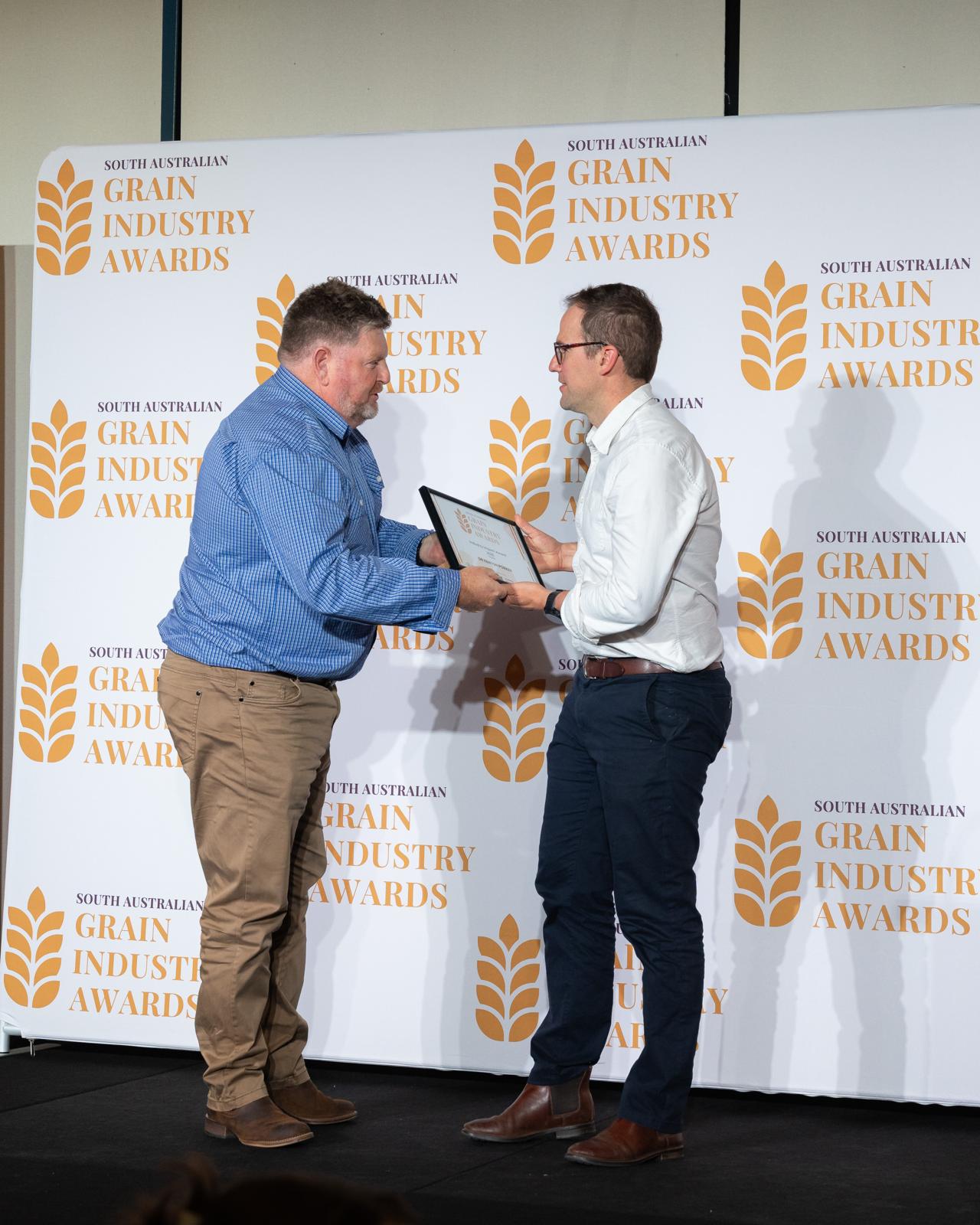 A certificate presentation on stage
