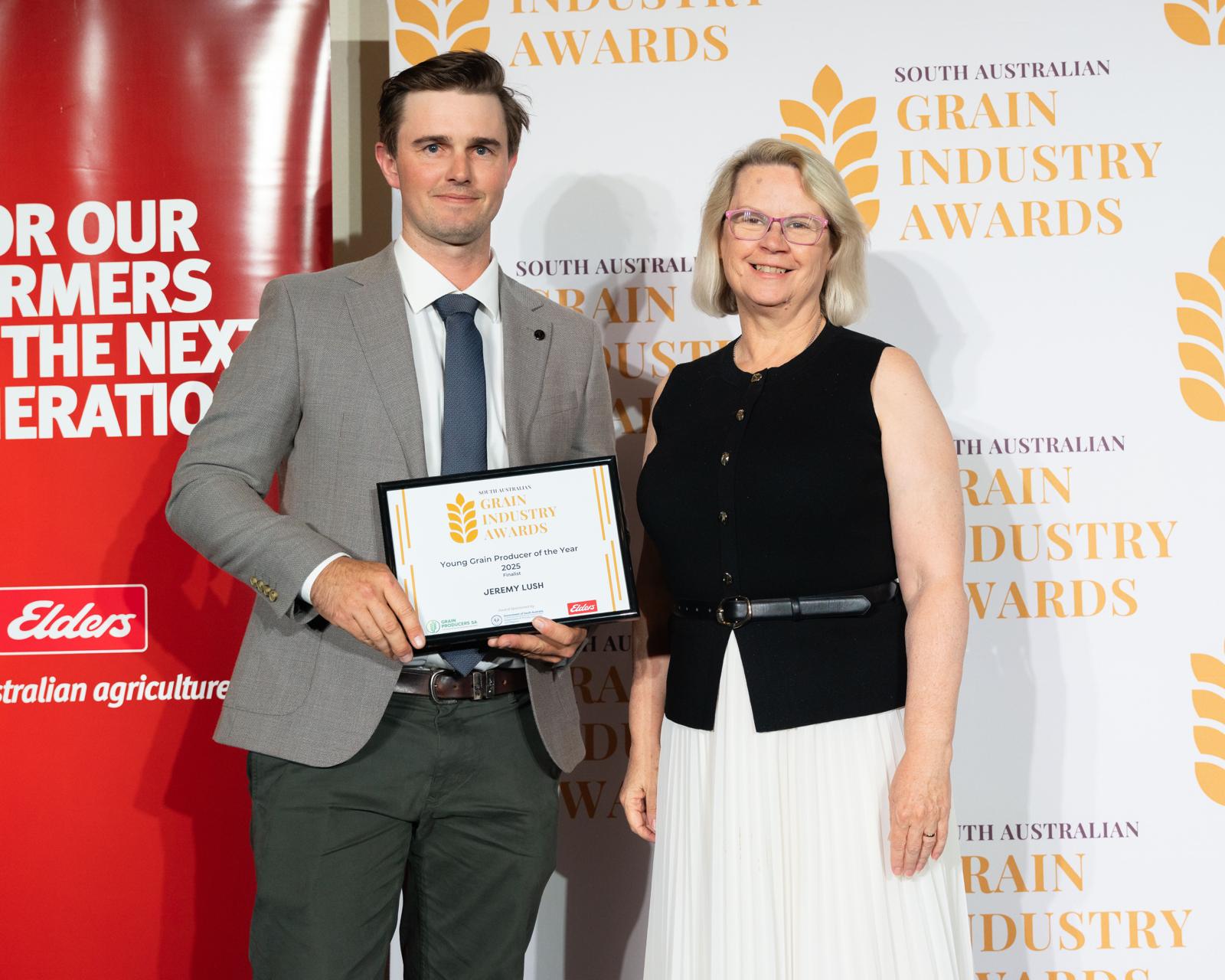 An award recipient with his certificate
