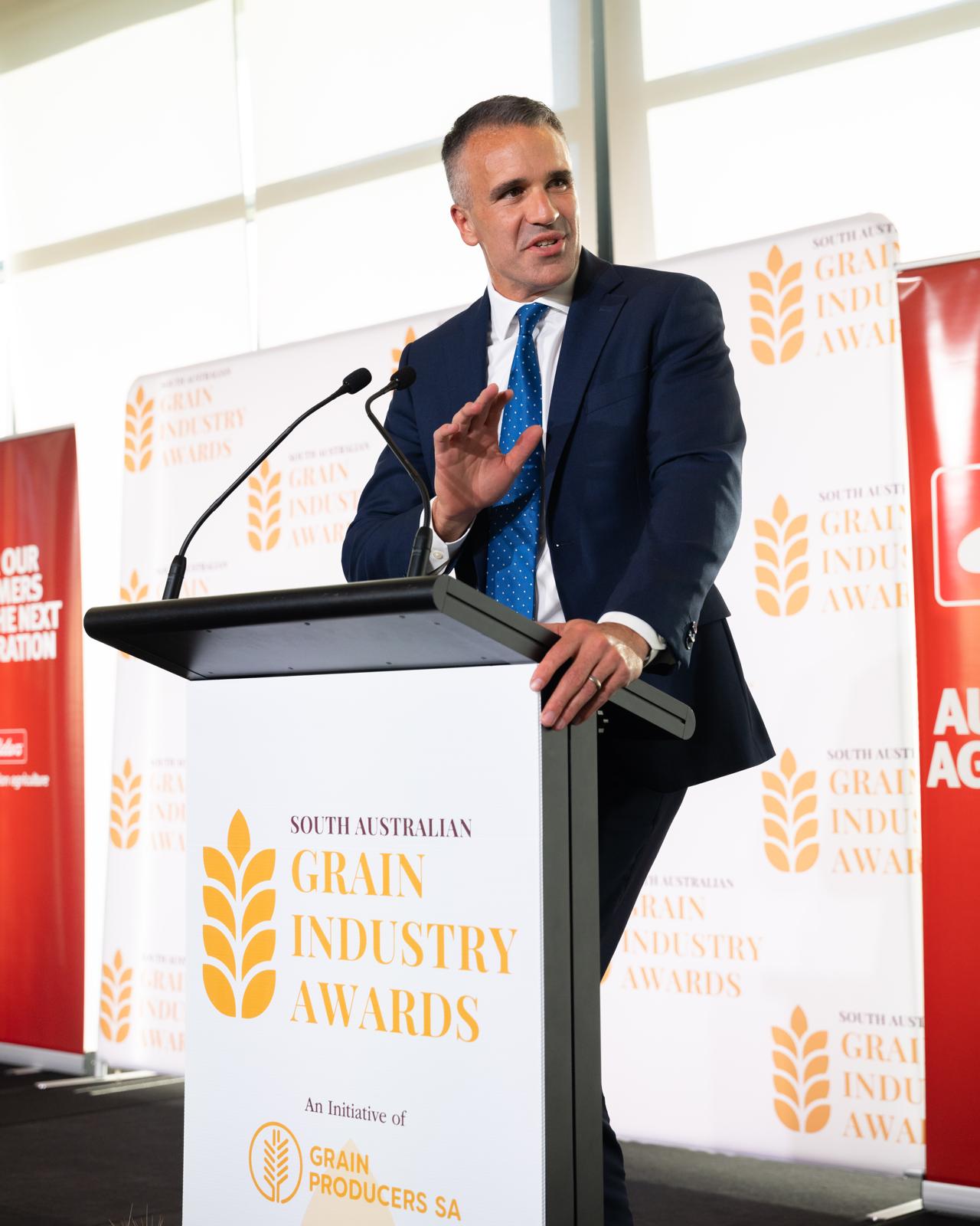 A speaker addresses guests from the lectern
