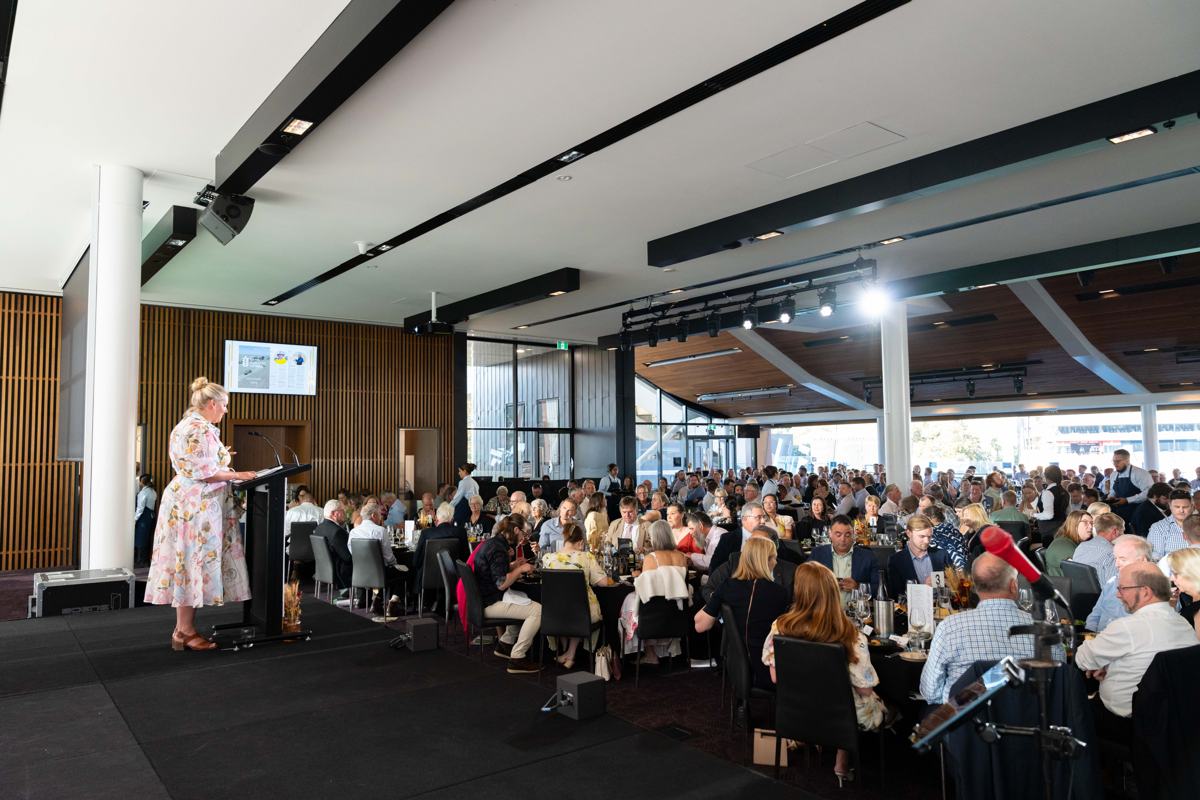 Guests listening to a speaker in the dining room at Adelaide Oval